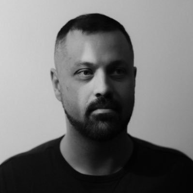 Black-and-white portrait of Justin Gilanyi